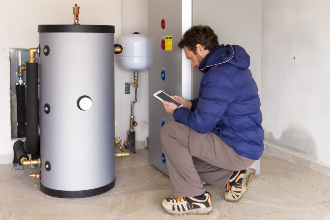 plumber at work making the consumption metering